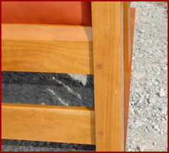 Close-up image of the beveled front seat rail and the doweled front leg, mortice and tenon construction.